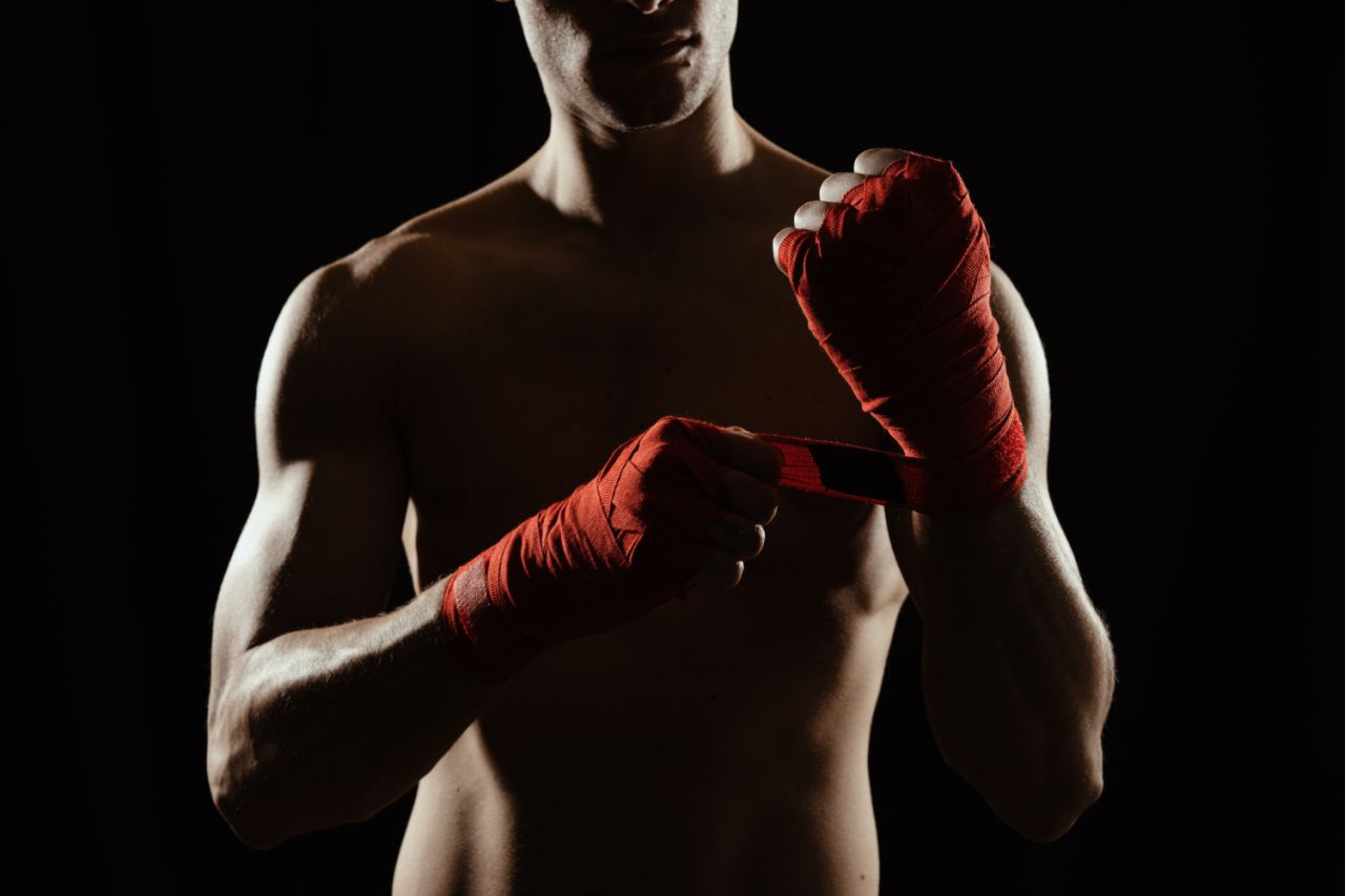 close up boxer bandaging hands (1)