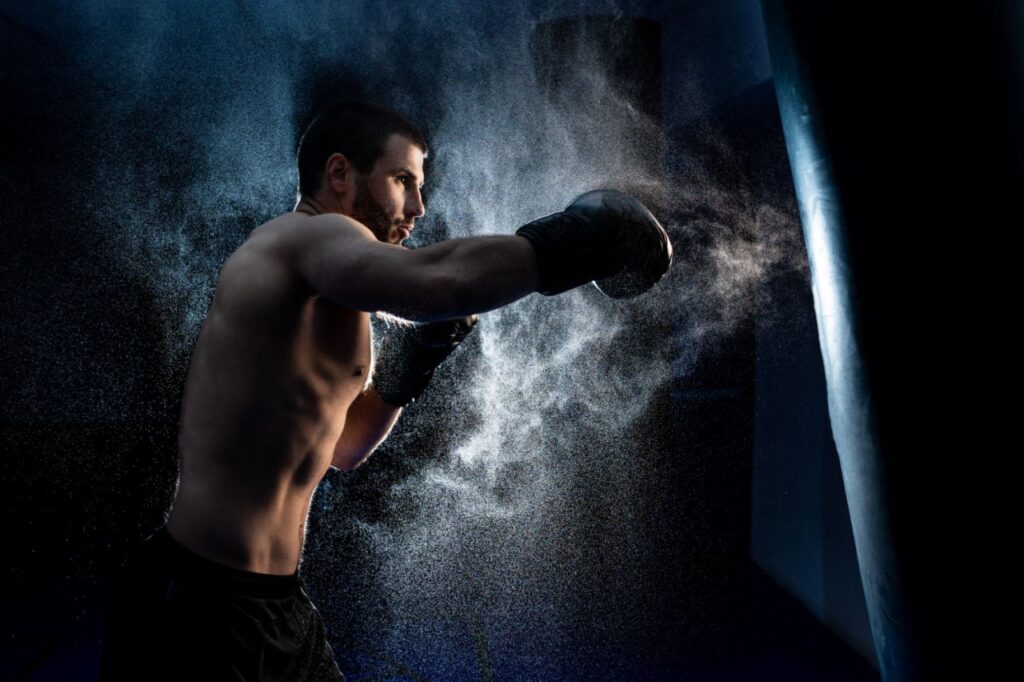 male boxer boxing punching bag