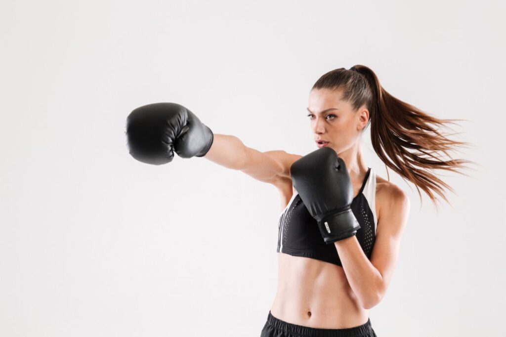 portrait young motivated woman doing boxing