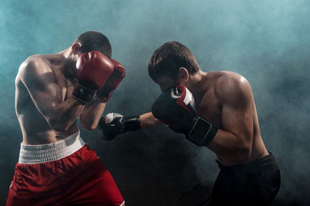 two professional boxer boxing black smoky